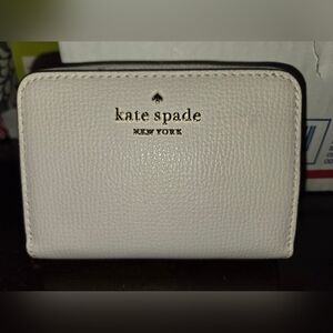 Kate Spade New York Pebbled Leather Wallet in Light Cream Color
